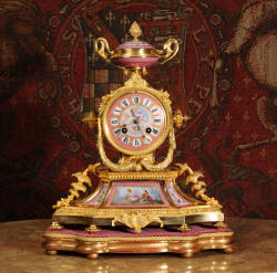 antique clock with porcelain Click here to enlarge